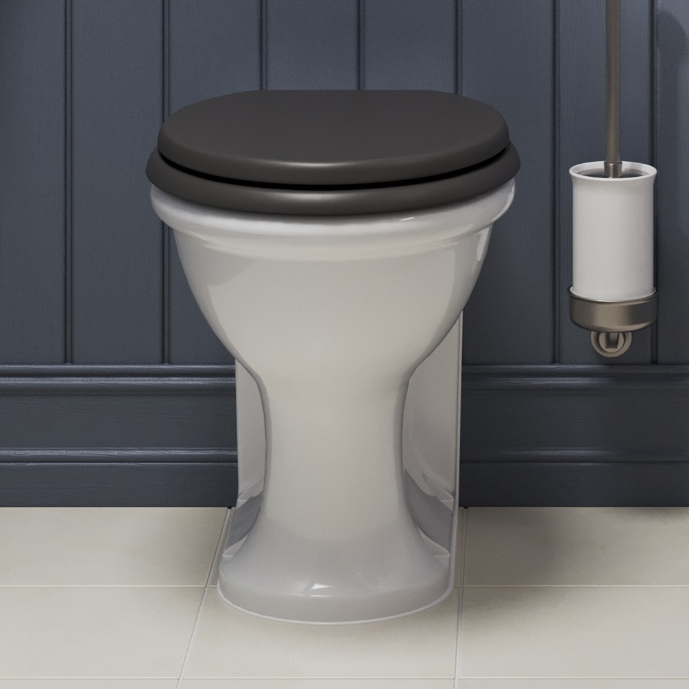 Product Lifestyle Image of Burlington Guild Back to Wall toilet with grey seat in blue panelled bathroom GU6117CW